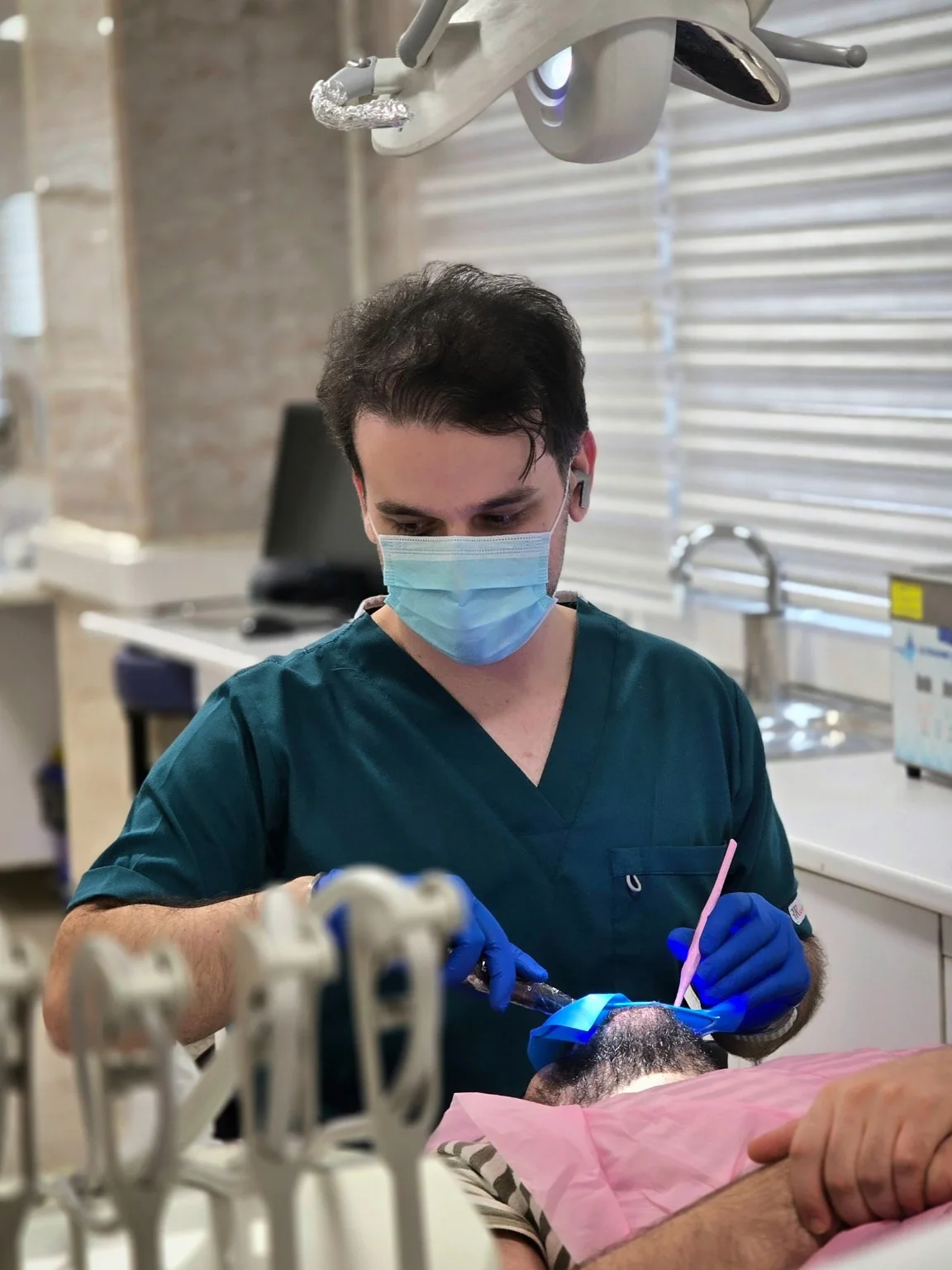 Dr. Pedram Amiri in a dental clinical setting